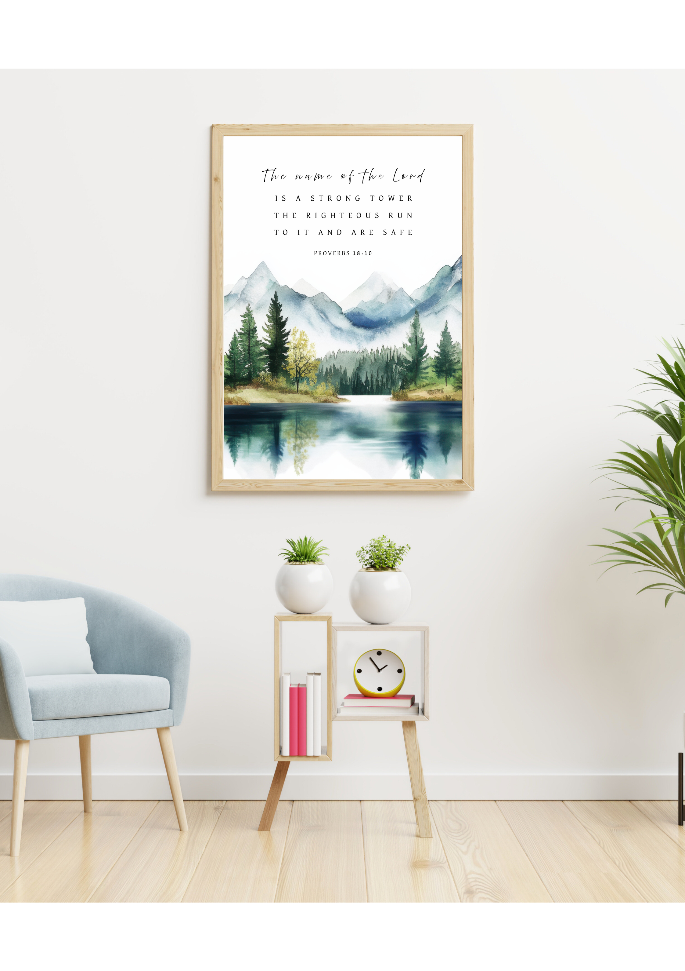 Christian giclee wall art print in scenic landscape with mountains, trees, and a tranquil lake, featuring Proverbs 18:10, "The name of the LORD is a strong tower, the righteous run to it and are safe". Made and printed in New Zealand. Available at  Cocosoy Joy NZ. Perfect gift and home decor.